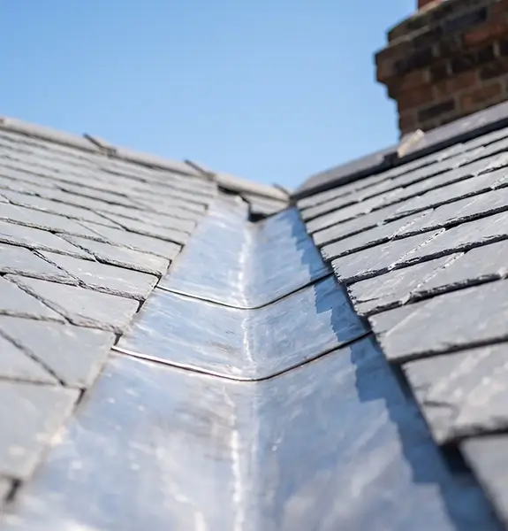 Roof cleaning and leadwork on a tiled roof